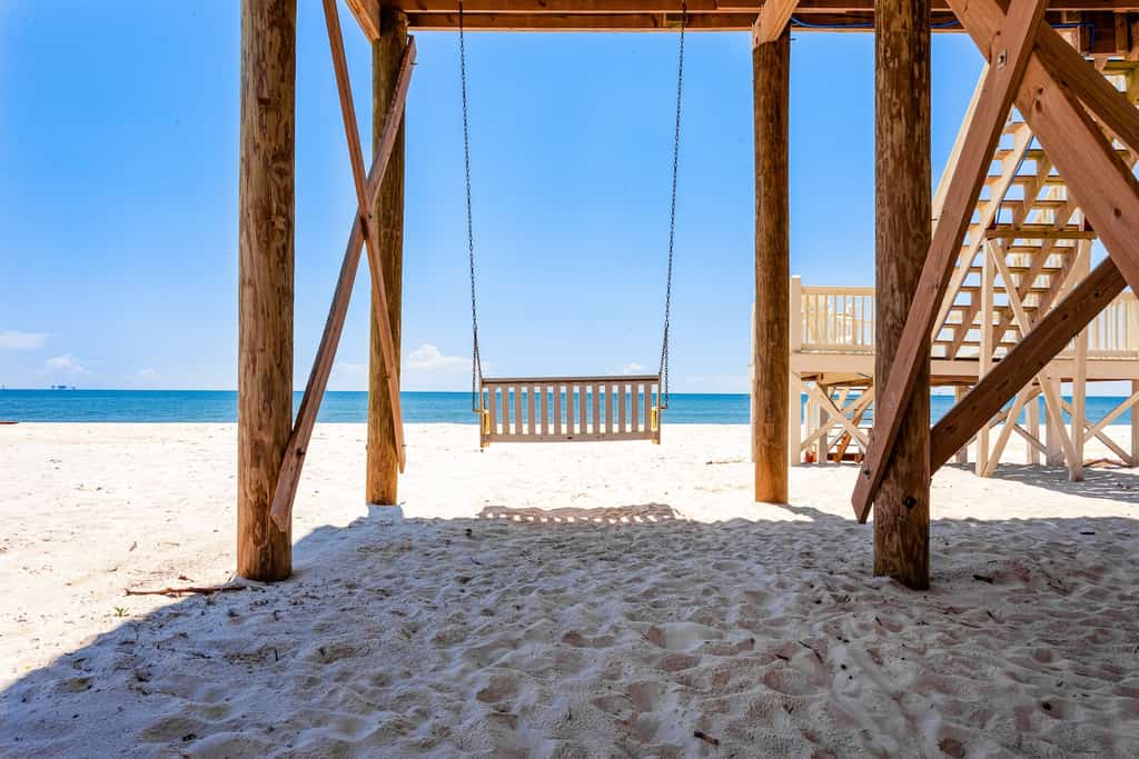 A swing bench on the coast.