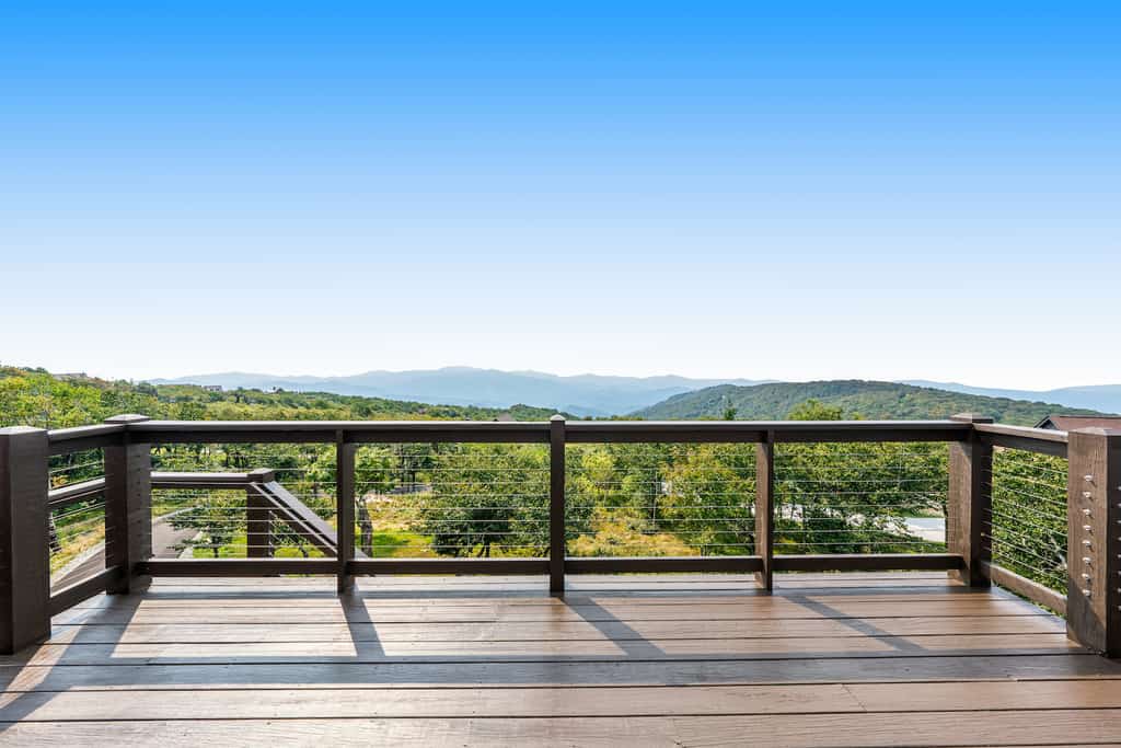 The deck overlooking the mountains at a Beech Mountain, NC vacation rental.