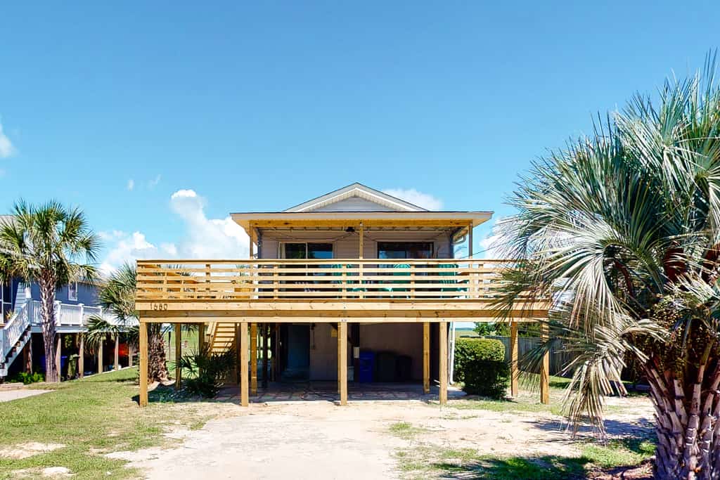 folly beach, sc beach house with two stories and wraparound deck