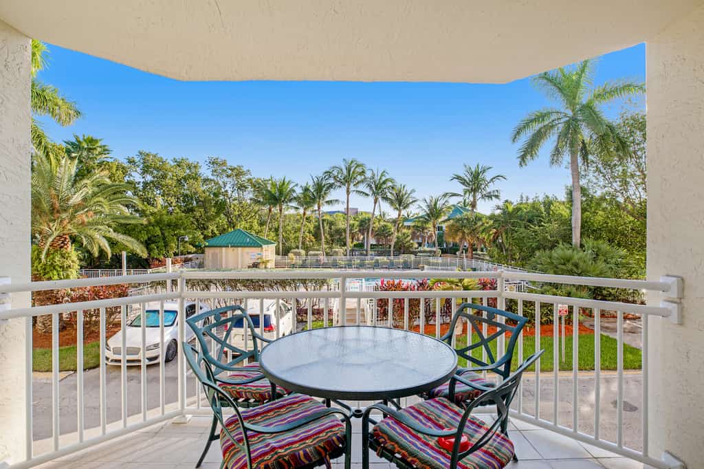 The patio with a bistro table and chairs at a vacation rental in Key West, FL.