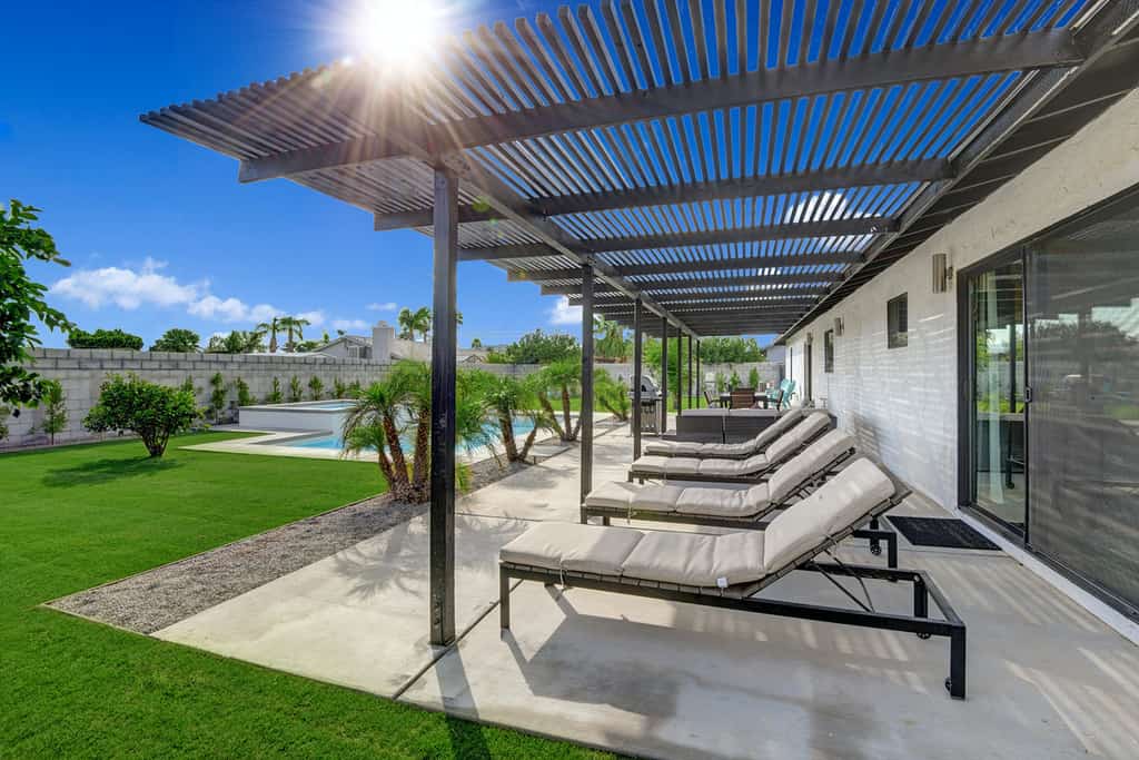 palm springs vacation rental with outdoor pool and large patio with lounge chairs
