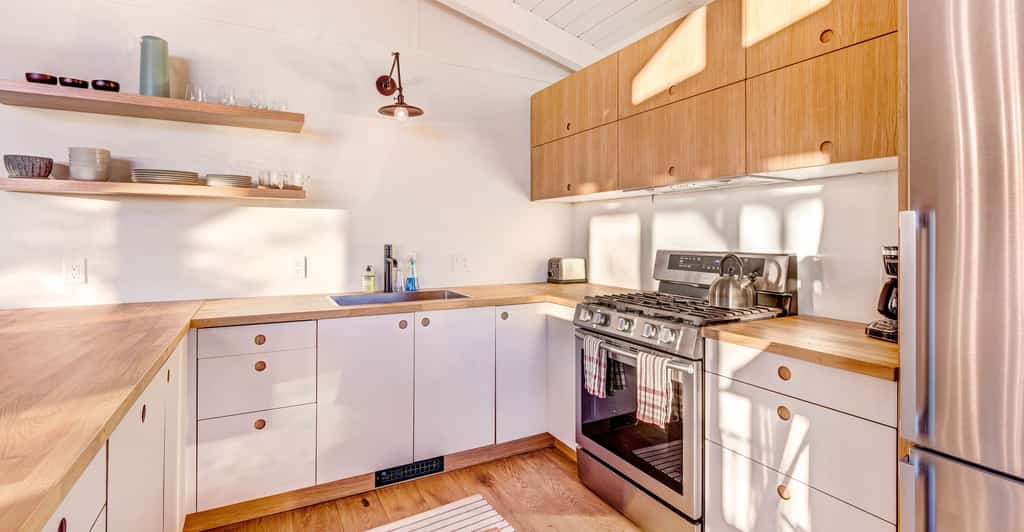 butcher block counters cover white cabinets in idyllwild, ca vacation home kitchen