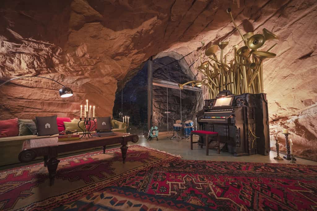 layered area rugs and large pipe organ inside the grinch's cave