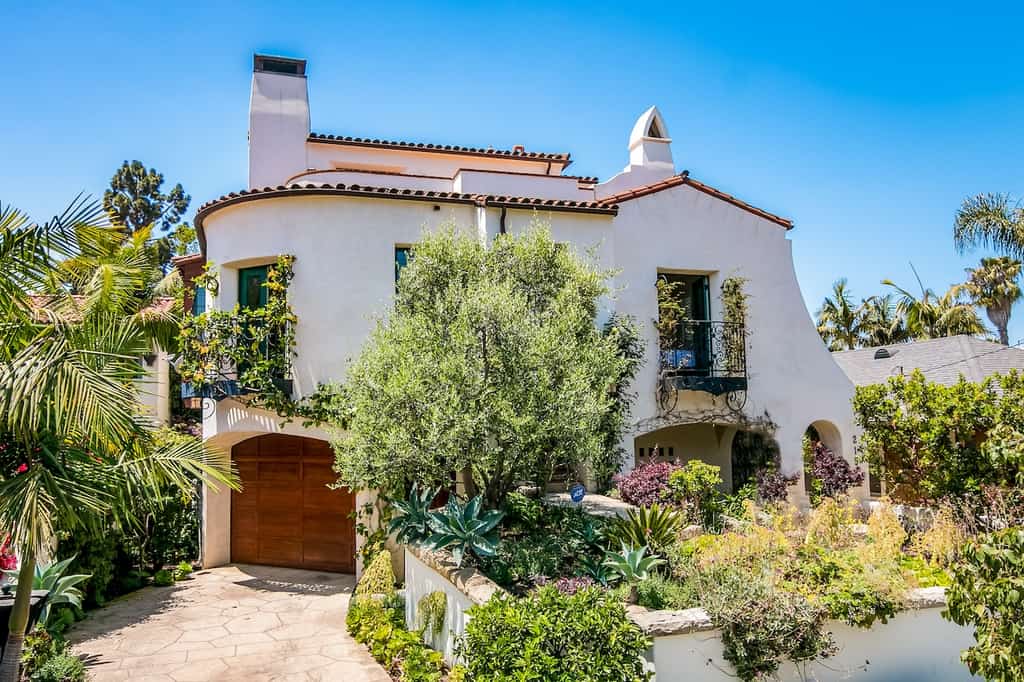 The exterior of a vacation rental in Santa Barbara surrounded by exotic plants.