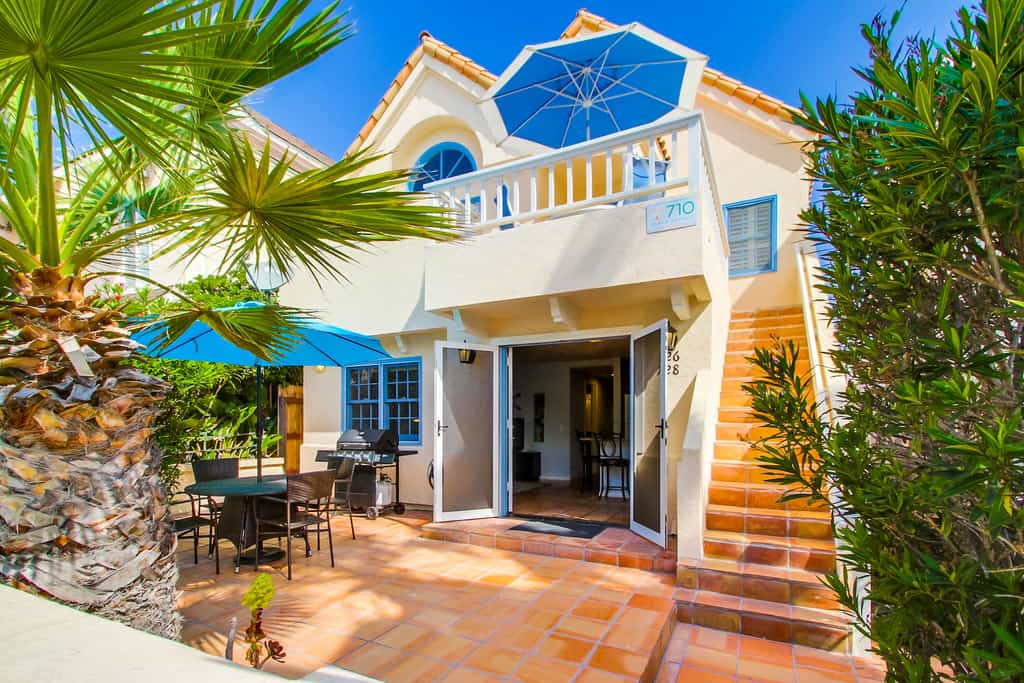 The front of a vacation rental in San Diego, CA with Spanish style architecture.