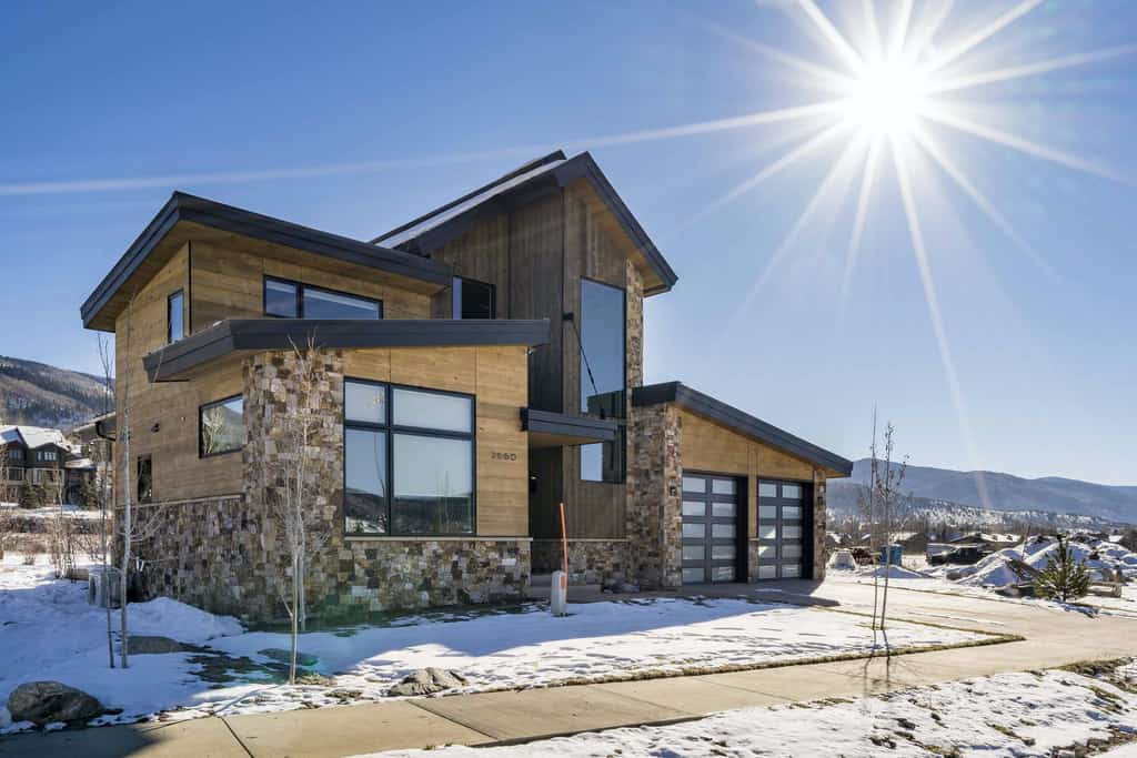 the winter sun shines brightly over vacation home in steamboat springs, co