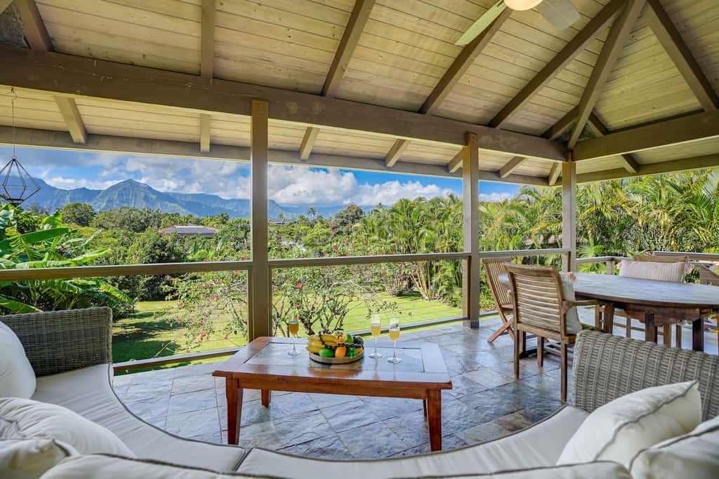 The covered deck overlooking the jungle at a vacation rental in Princeville, HI.