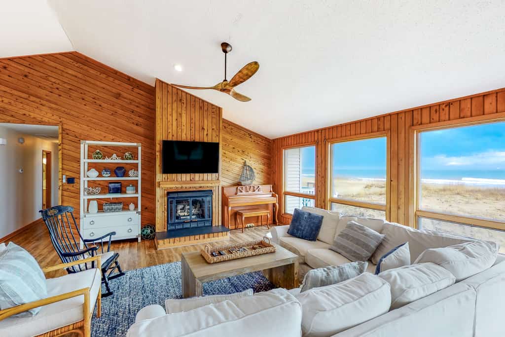 open living room with large windows overlooking the beach in Virginia Beach