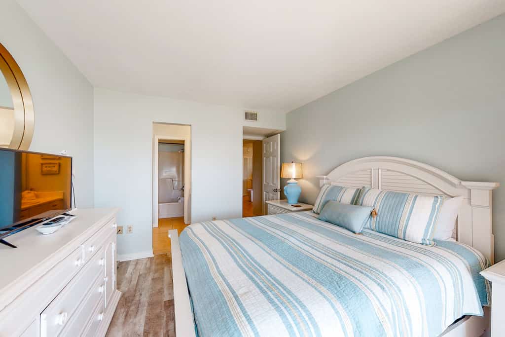 The bedroom of a vacation rental in Fort Morgan, AL at the Plantation Palms.