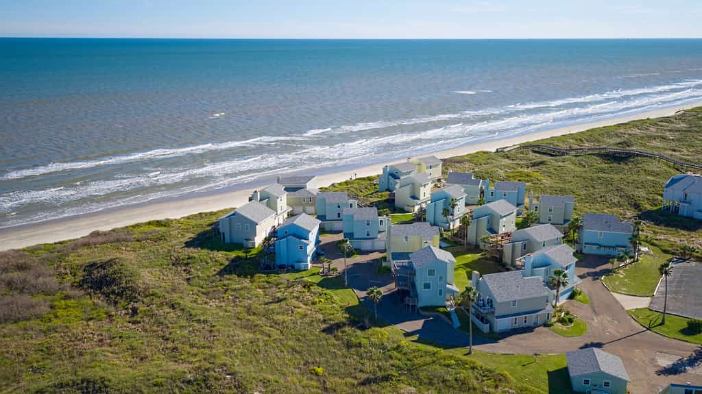 Drone shot of condos known as the Lost Colony in Port Aransas with ocean views.