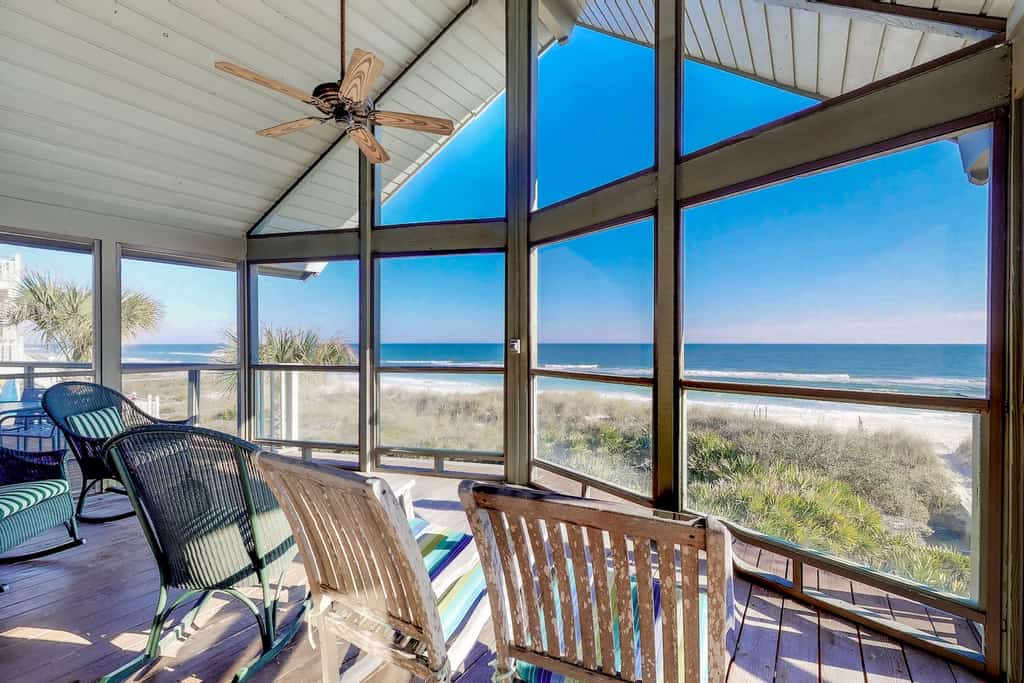 The sunroom overlooking the ocean at a St. George Island rental.