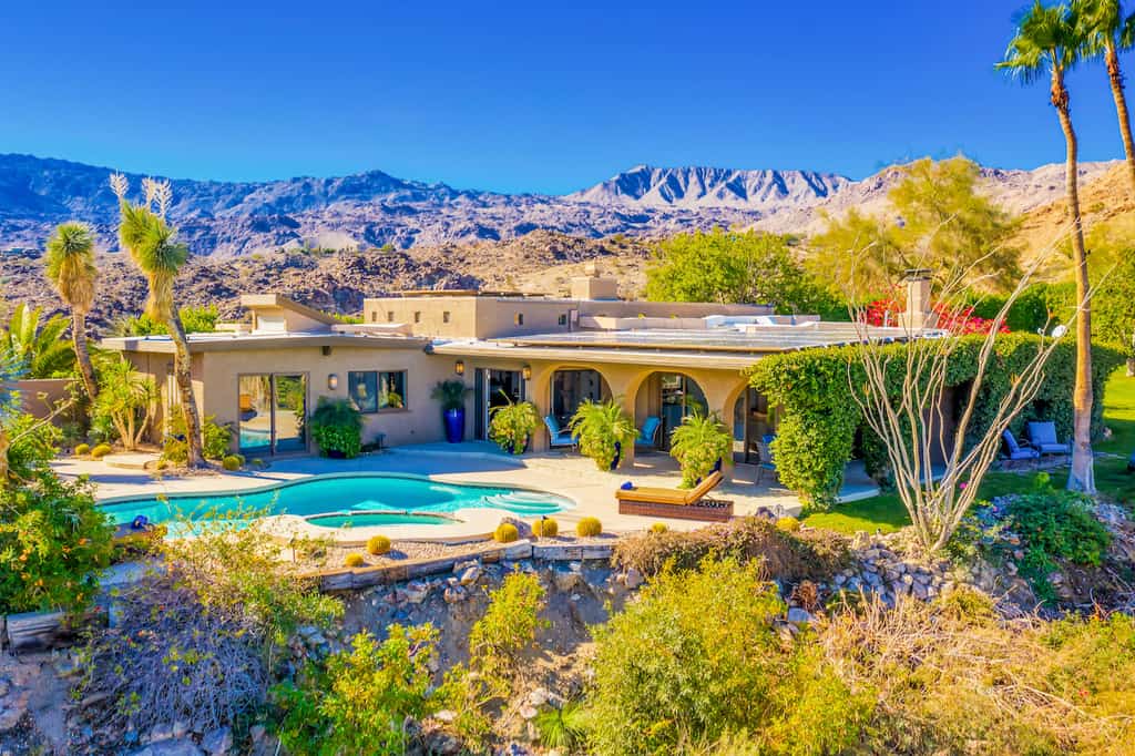 Palm Desert home with a pool overlooking the mountains
