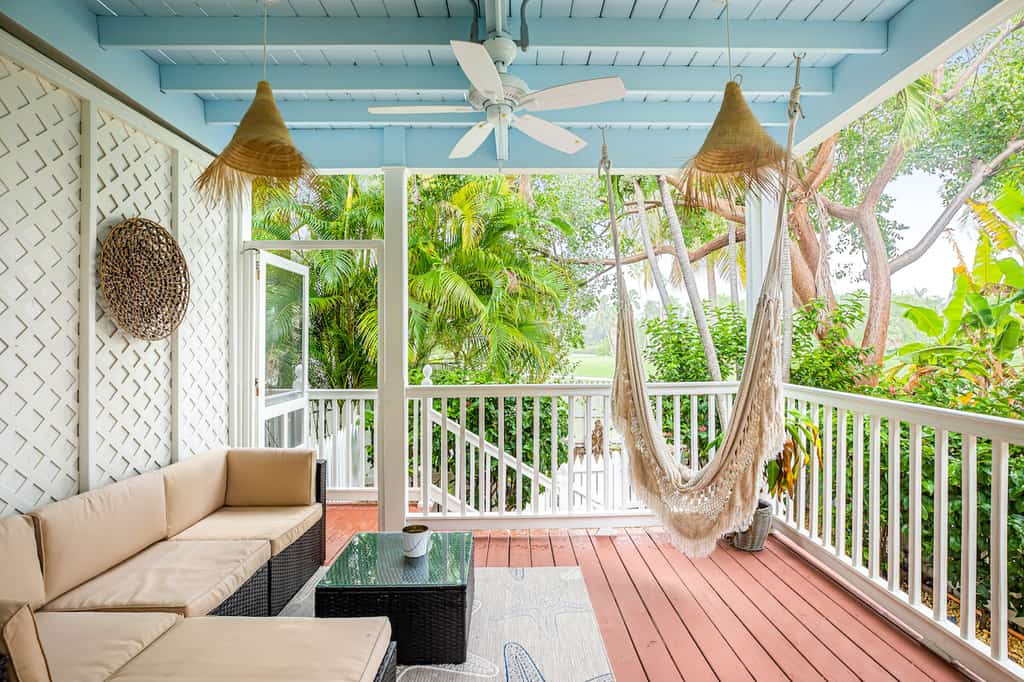 The front deck with hammock overlooking a golf course at a vacation rental in Key West, Florida.