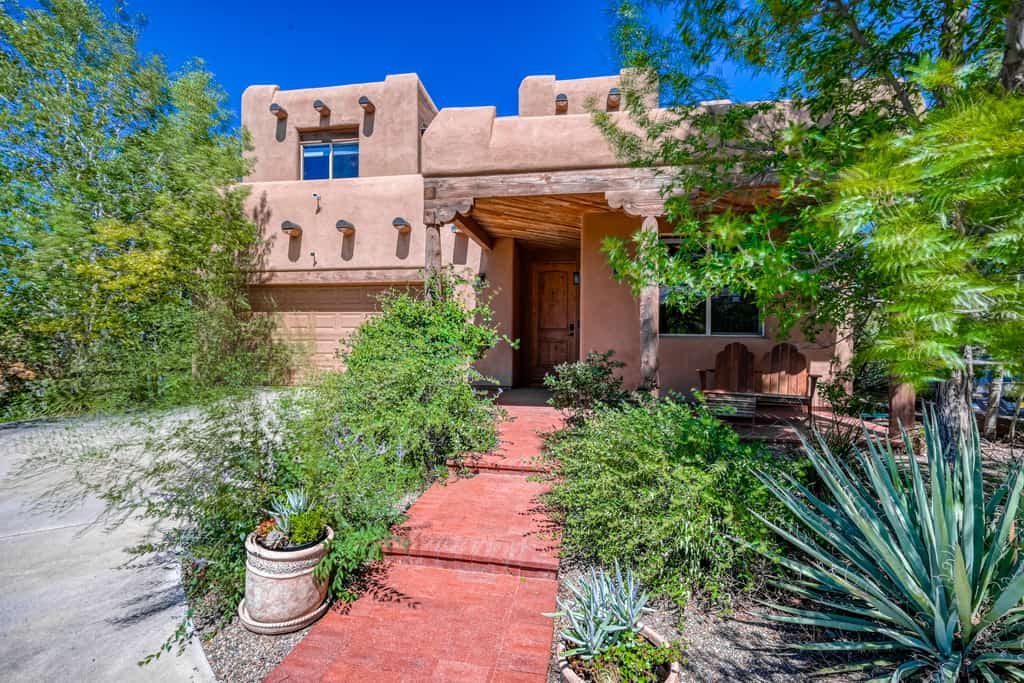santa fe home surrounded by desert plants
