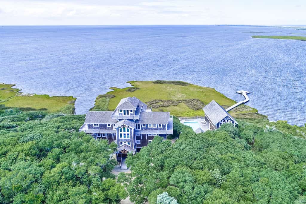 Drone shot of a vacation rental overlooking the ocean in Buxton, NC.