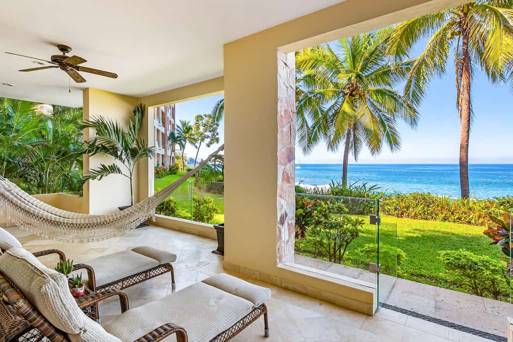 The back area with hammock and chairs overlooking the ocean at a Puerto Vallarta rental.