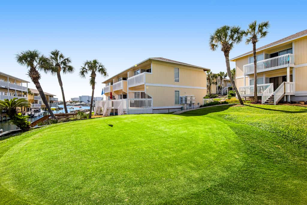 The green surrounded by homes at Sandpiper Cove in Destin, Florida