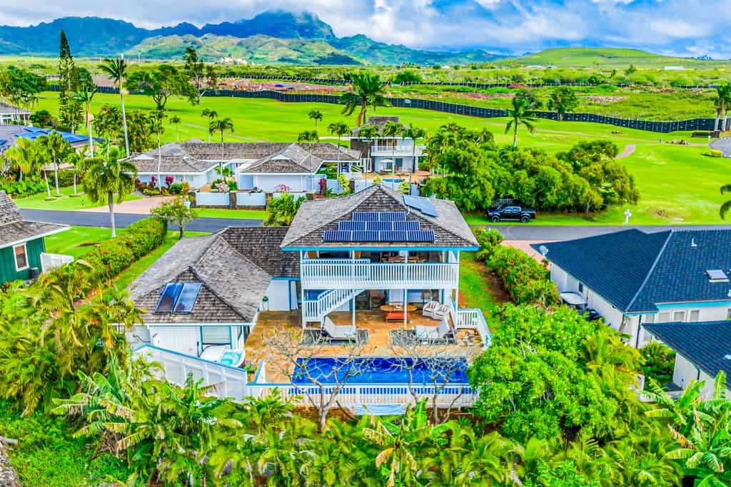 Drone shot of a vacation rental with a pool in Koloa, HI.
