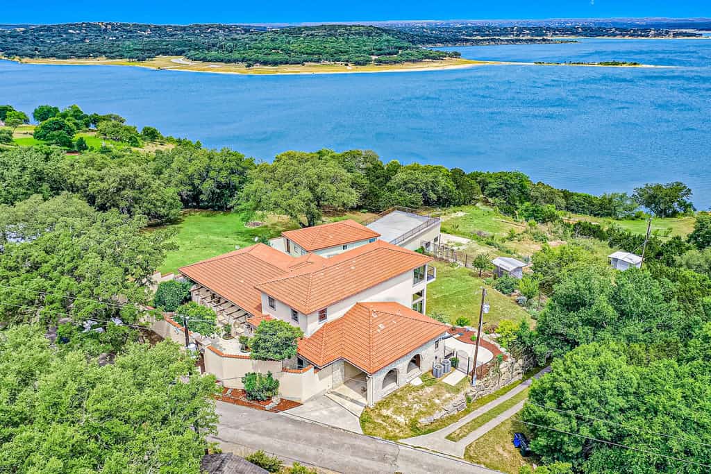 Drone shot of a house overlooking Canyon Lake, TX.