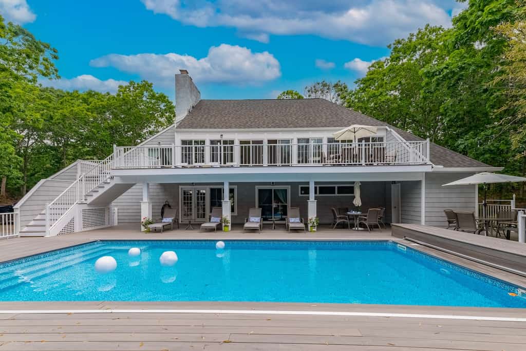 A Southampton, NY vacation rental pool with an elegant two story design.