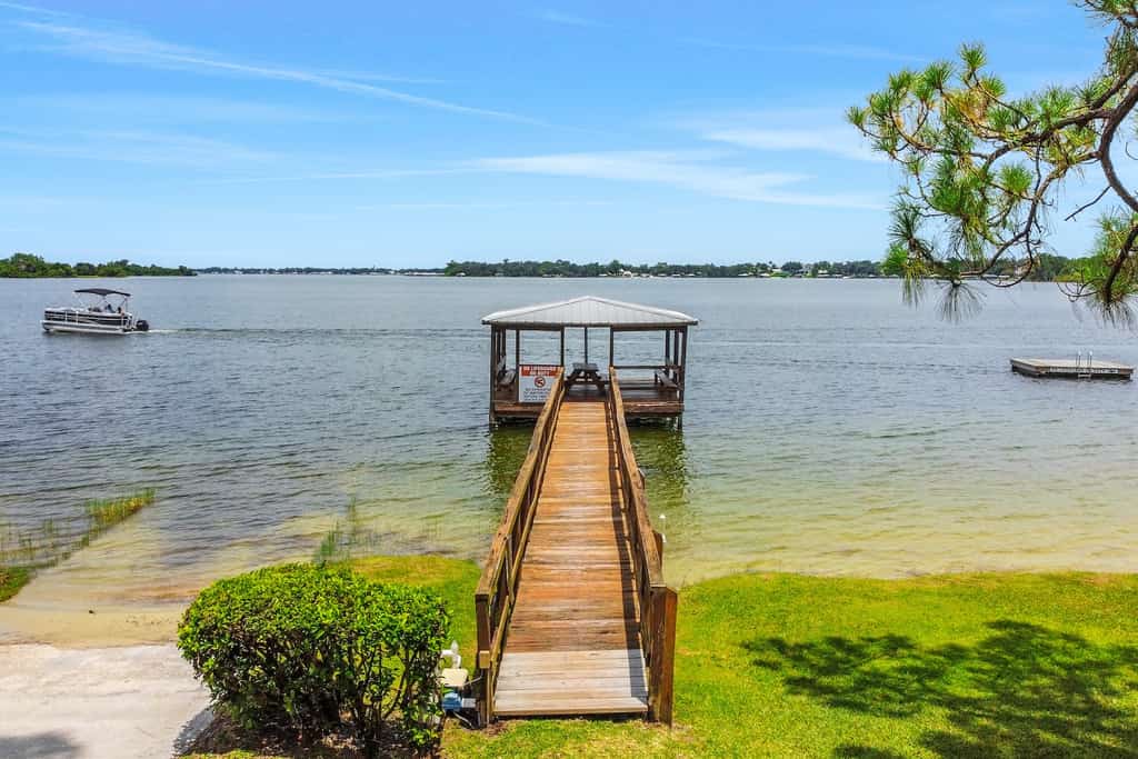 A dock with a covered area on Lake Placid.