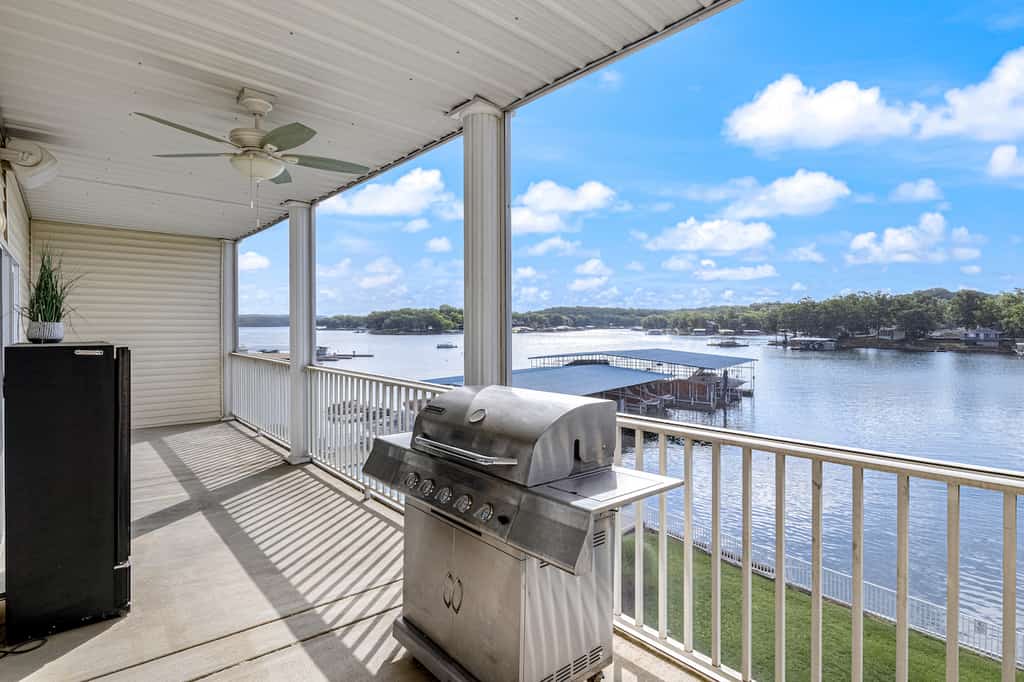 The view of the water from the deck of a pet-friendly rental in Sunrise Beach, MO.