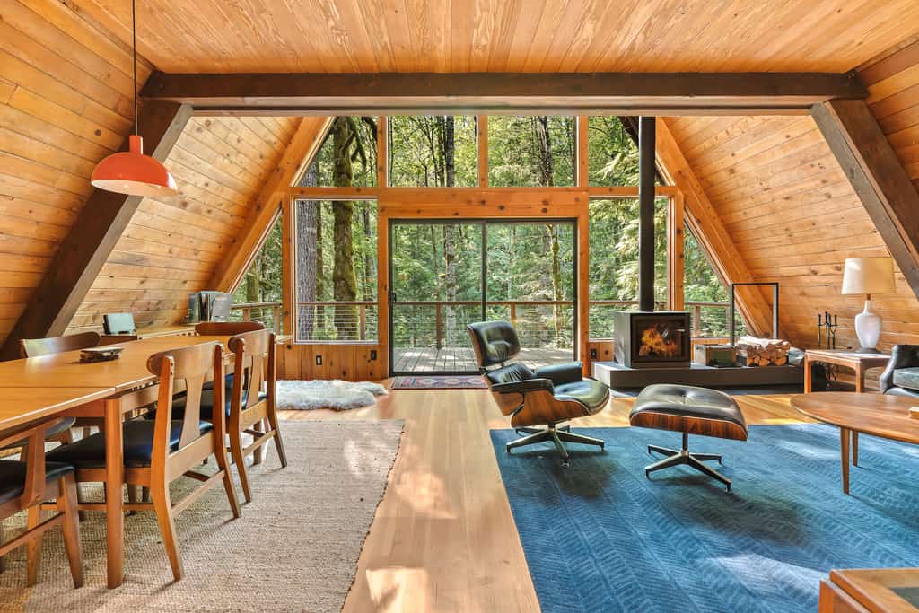 The exterior of an a-frame cabin rental in Rhododendron, OR. with modern design.