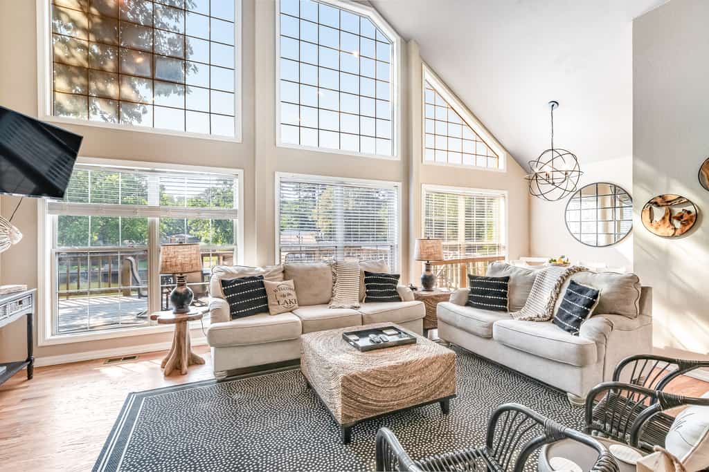 interior of Hot Springs vacation home with cozy couches and floor to ceiling windows