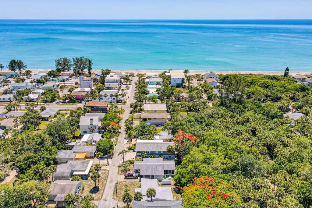 Drone shot of Englewood, FL overlooking homes and the beach.
