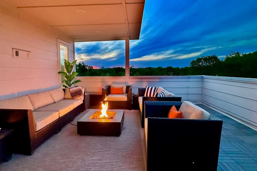 The roof deck with a far and chairs at a Nashville, TN vacation rental.