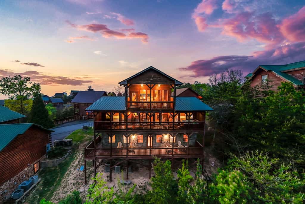 A large cabin at dusk.