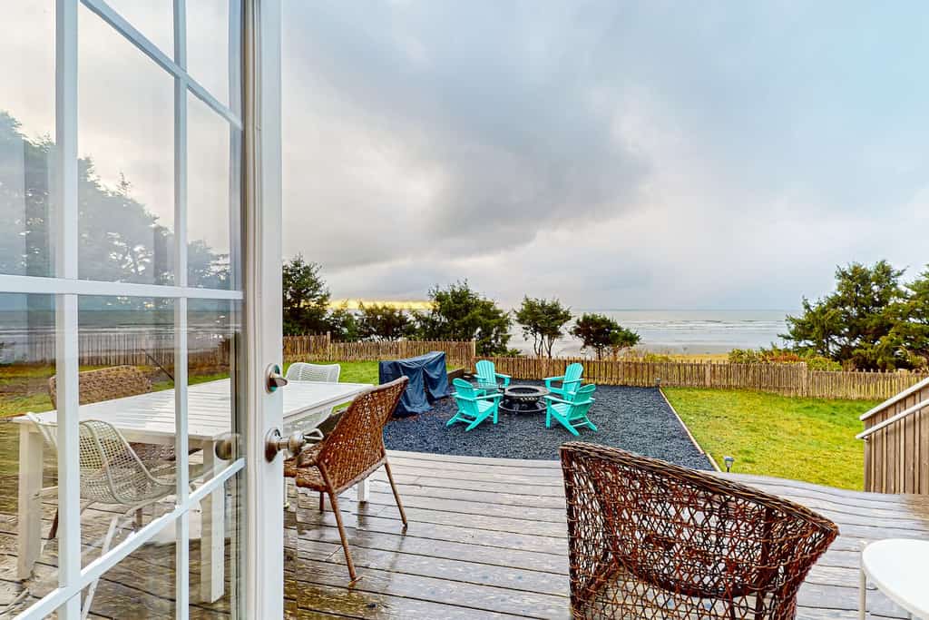 View of the back deck area overlooking the coastline at a Moclips, WA vacation rental.