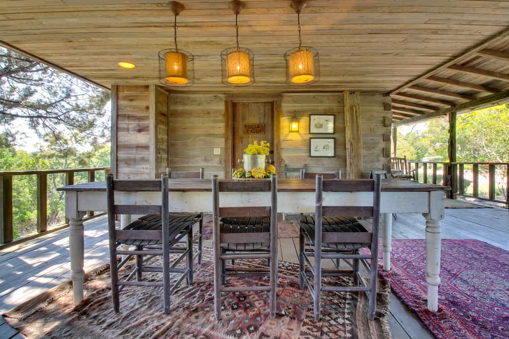 The outdoor area with a table at a cabin rental in Fredericksburg, TX.