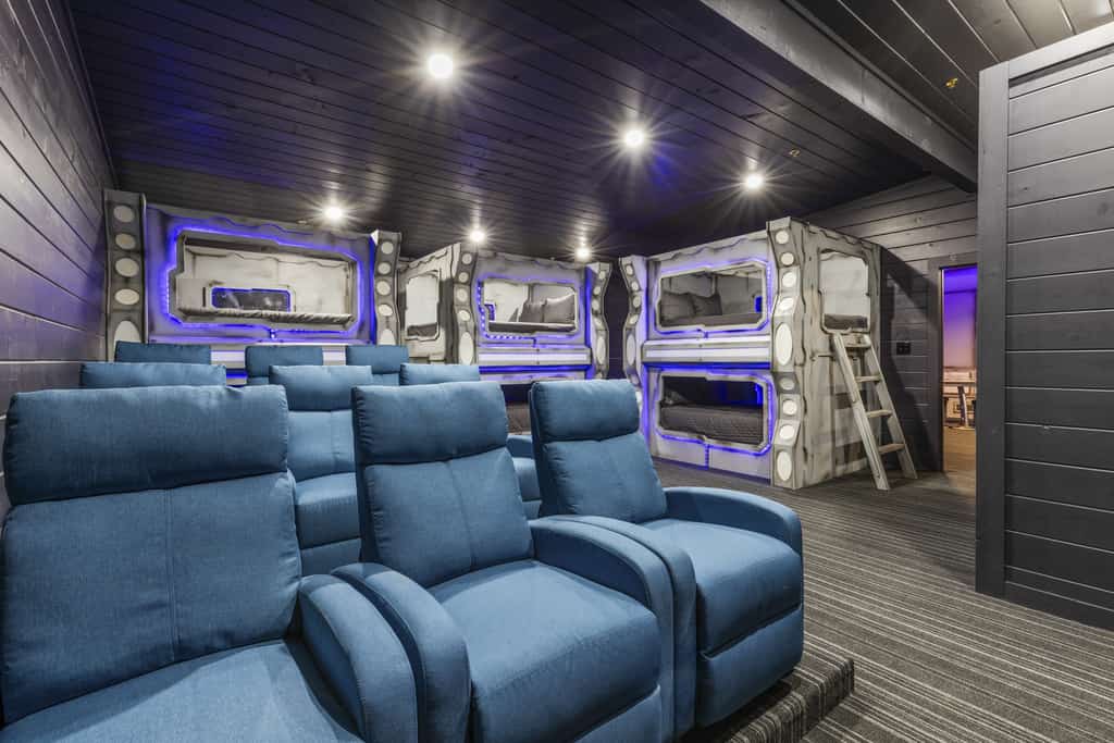 private theater room with space themed bunk beds in pigeon forge cabin