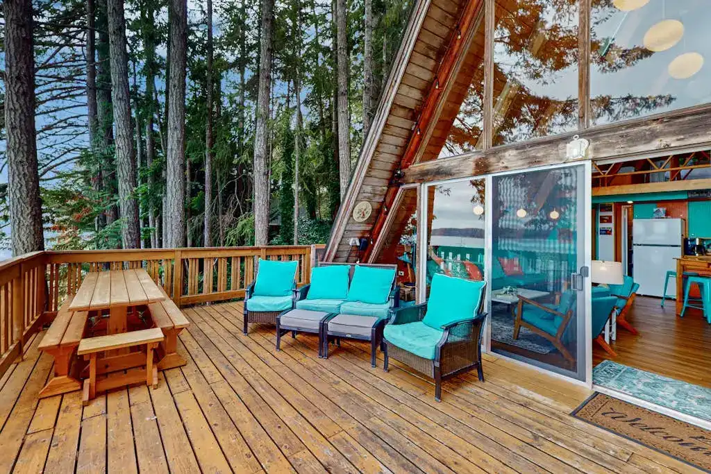 wooden deck with furniture on A frame cabin