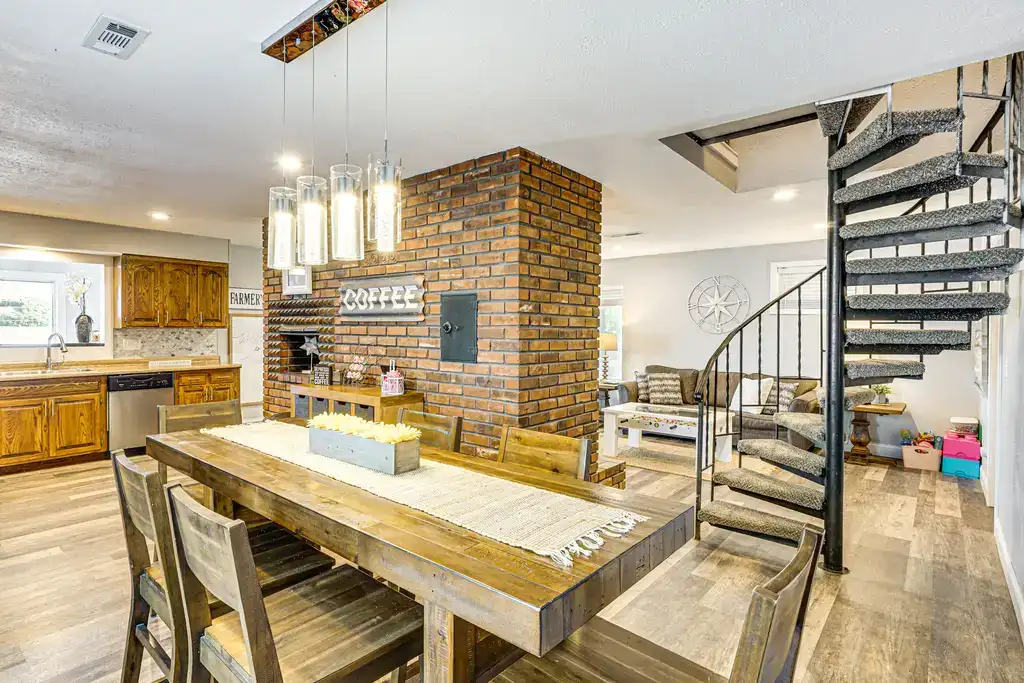 vacation rental living space with spiral staircase