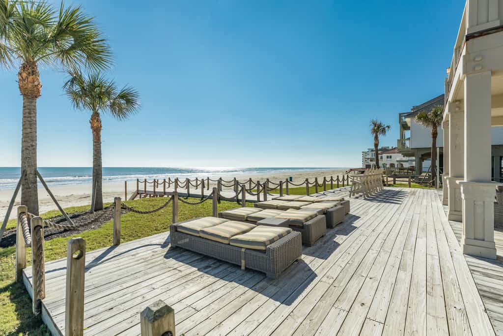 Lounge chairs sit on deck of gulf-front resort in Galveston, TX