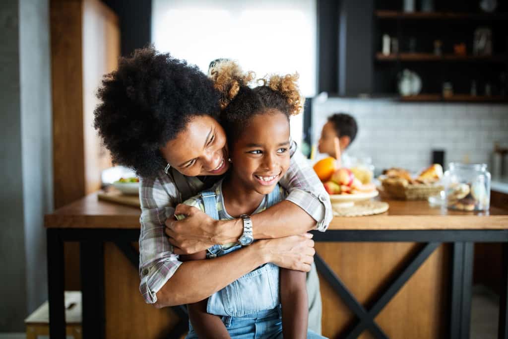 woman hugs her child