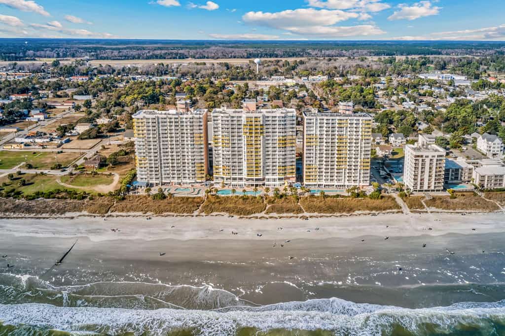 A drone shot on the coast covering the Bay Watch Resort.