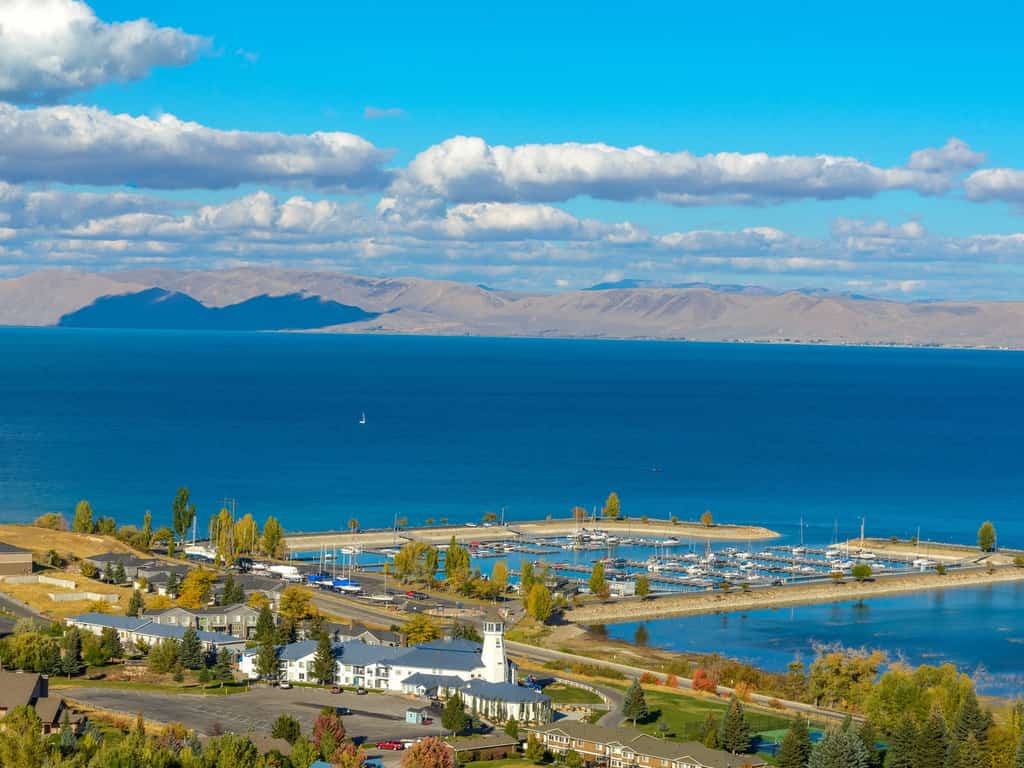 beautiful lake in Idaho surrounded by a small town and mountains