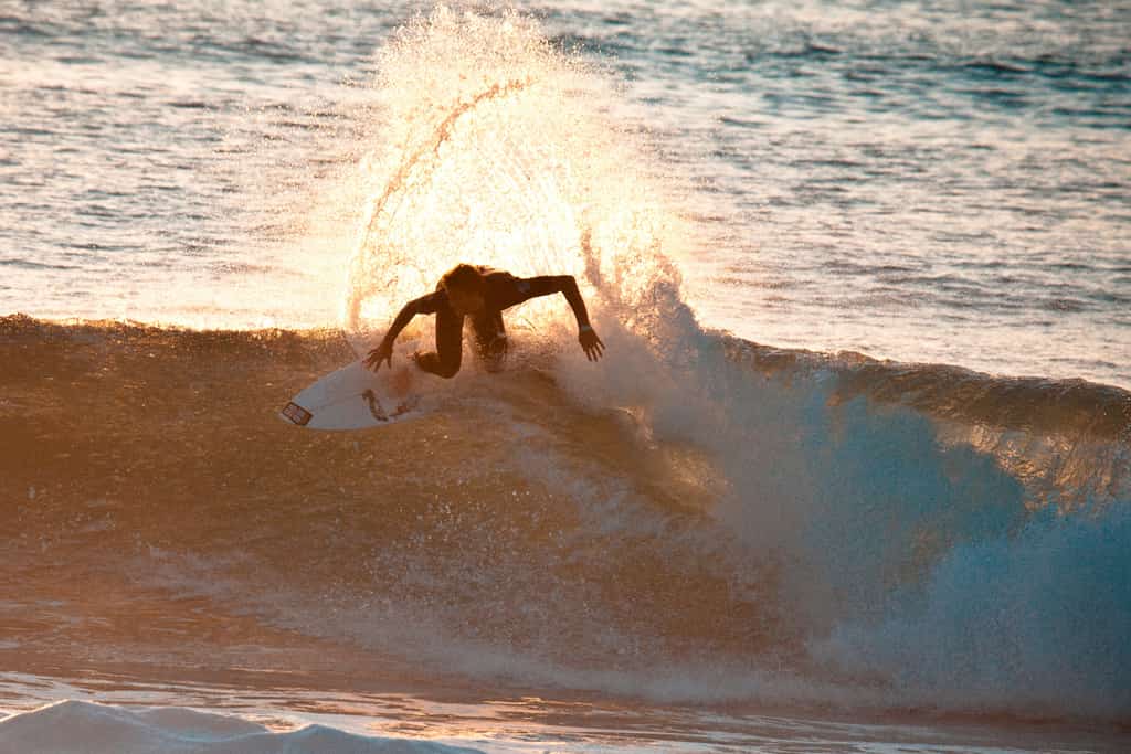Surfer in Belize riding a wave