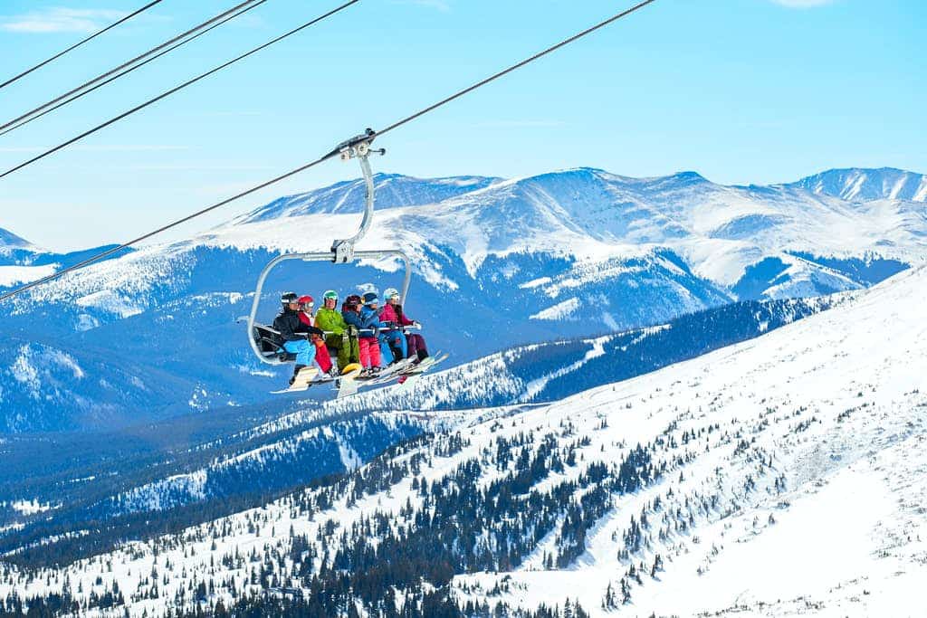 family of 6 rides the ski life in the breckenridge mountains