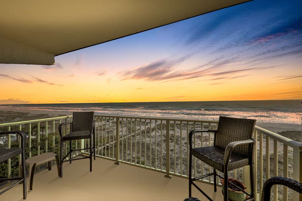 Balcony overlooking the ocean and beach during sunset in Cocoa Beach, FL