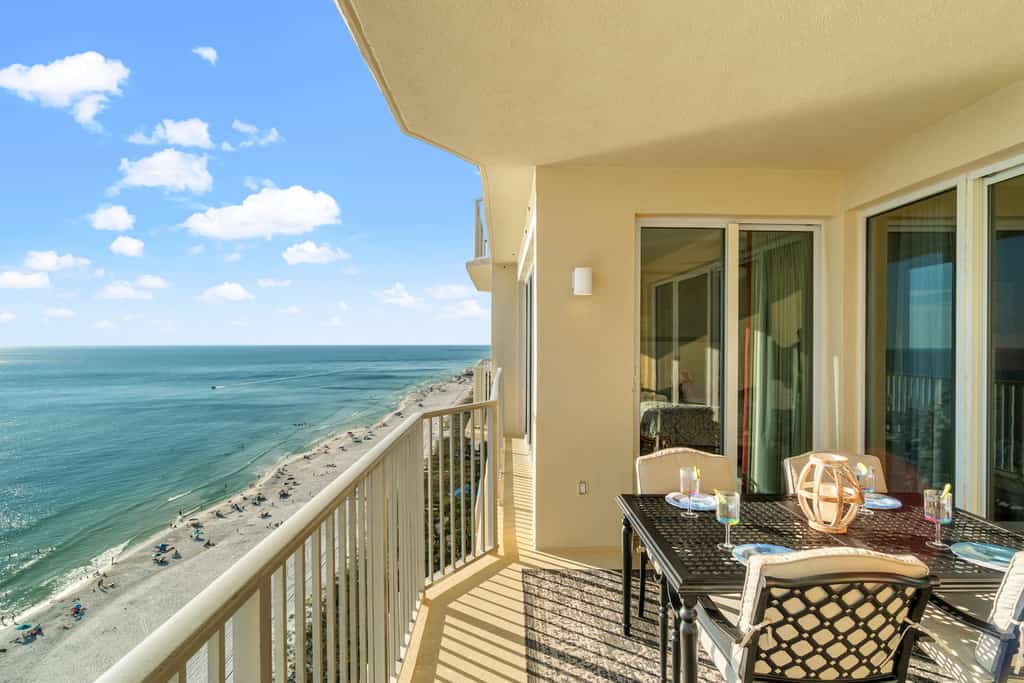 The view from a balcony overlooking the coastline at a vacation rental condo in Panama City Beach.