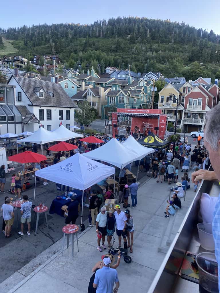 People on a balcony attending a festival in Park City.
