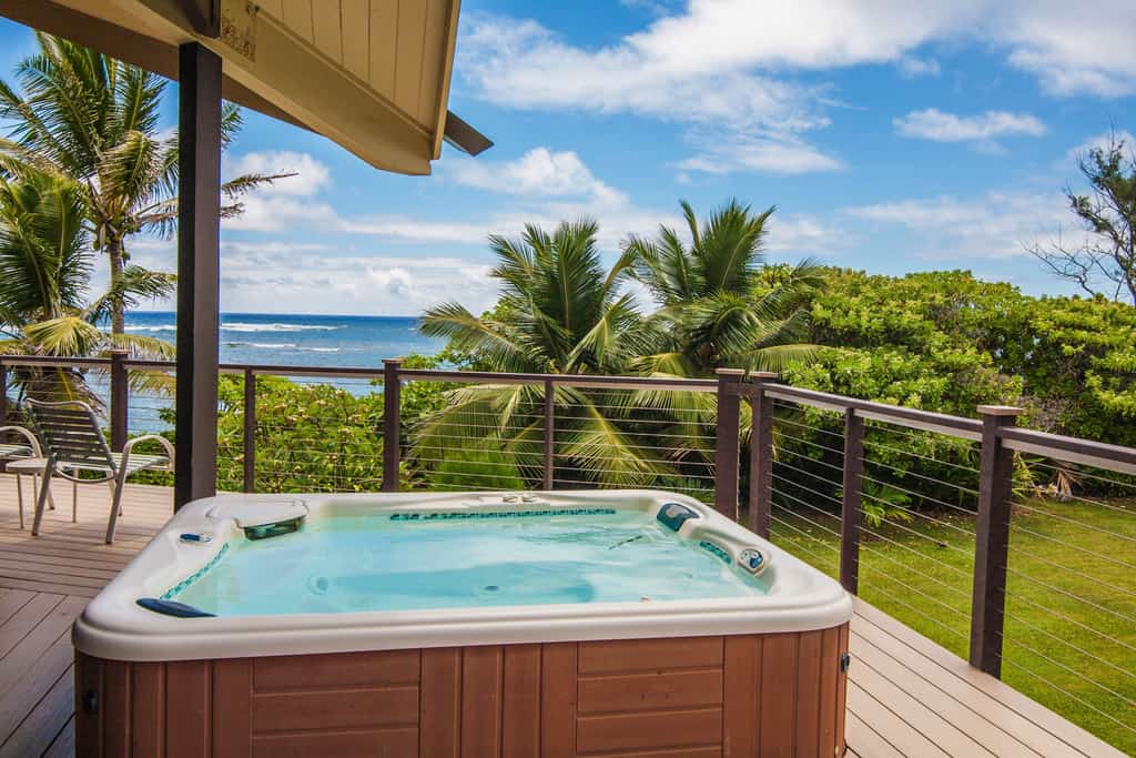 Private hot tub with beach and ocean views from Kauai, HI beach home