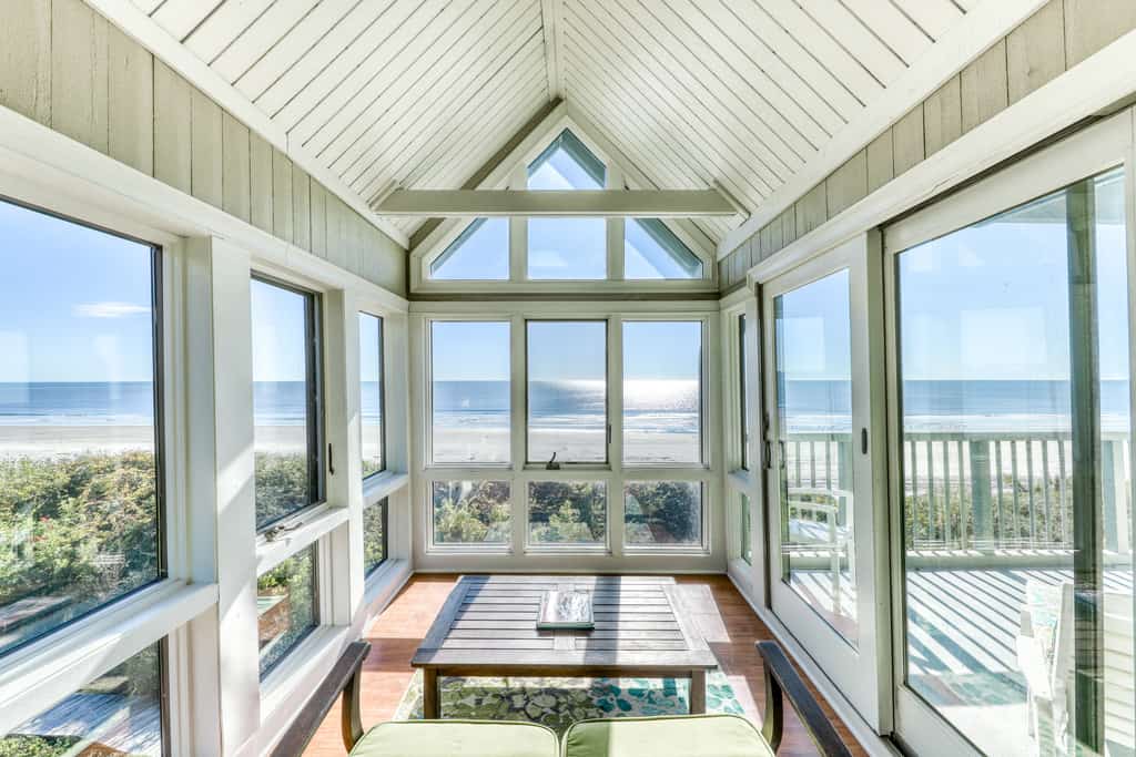 The view of a sunroom at a vacation rental in Kiawah Island.
