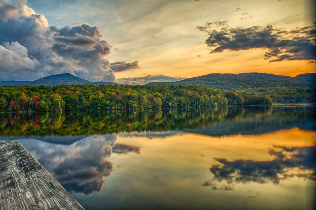 clouds reflect on the surface of a body of water in Killington