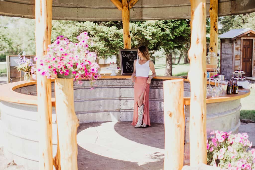 Woman hanging out at an outdoor bar.