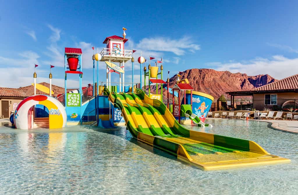 kids play pool in Paradise Village surrounded by red rocks